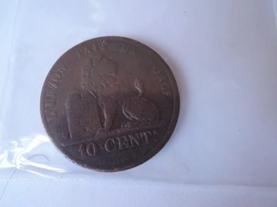 a coin that is in a plastic bag on a table
