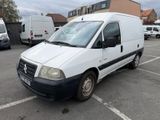 a white van that is parked in a parking lot