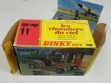a box of dinky toys sitting on a table