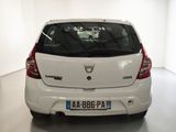 a white car that is parked in a white room