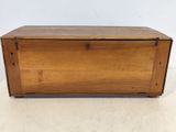 an old wooden box with a metal latch on the top