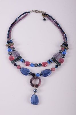 purple and blue beaded necklace with a tear shaped pendant