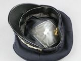 a black hat with a zipper on top of it