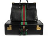 a black briefcase with a green and red stripe on the side