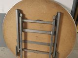 a picture of a round table with a ladder on it