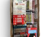 a cardboard box full of books on a white surface