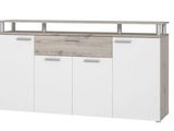 a close up of a white cabinet with drawers and a shelf