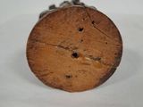 a piece of wood that is sitting on a white surface