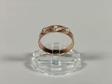 an image of a wedding ring on a clear stand