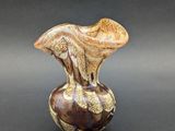 a small vase that is sitting on a table