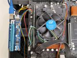 a close up of a computer motherboard with wires and a fan