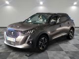 the silver suv is parked on a checkered floor in a garage