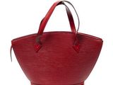 a red louis vuitton bag on a white background