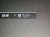a close up of a label on the back of a laptop