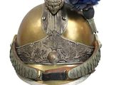 a close up of a helmet with a feather on it