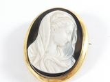 an image of a woman wearing a veil in a black and white cameo
