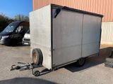 l'image d'un camion auquel est attachée une remorque