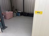 a picture of a storage room with a door open