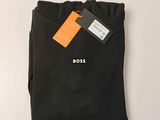 a close up of a black t - shirt with a tag on it