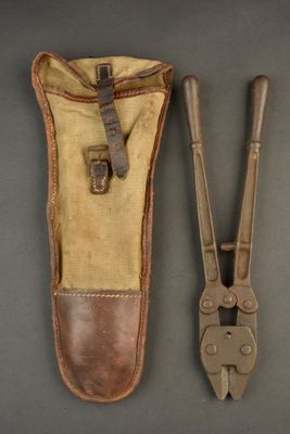 pair of old tools sitting on top of a table next to each other