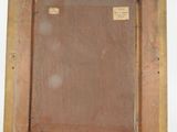an old wooden picture frame with a label on it