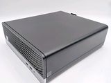an image of a black computer on a white surface