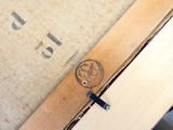 a close up of a piece of wood with a stamp on it