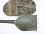 a shovel and a bag sitting on a table