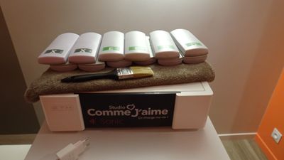 several rolls of toilet paper are stacked on top of a box