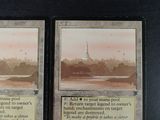 two cards that are sitting on a table