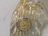 a close up of a glass object with a clock on it