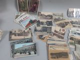 a lot of old postcards sitting on a table