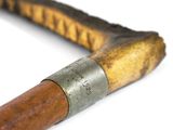 a close up of an old baseball bat on a white surface