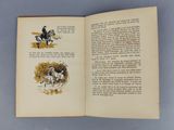 an open book with a picture of a man riding a horse