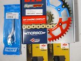 the contents of a bicycle chain and sprocket are laid out on the table