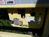 a close up of a yellow machine with buttons on it