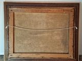 an old picture frame with a rope hanging from it ' s side