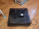 a laptop that is sitting on the floor next to a box