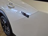 a close up of a car door with a sticker on it