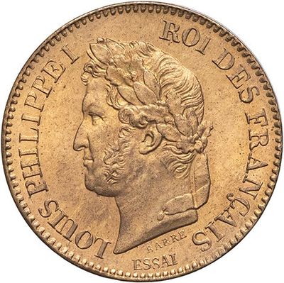a gold coin with the head of a man in profile