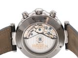 a close up of a watch on a white surface