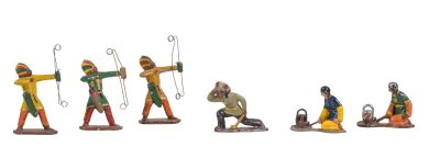 several figurines of men with bows and arrows on a white background