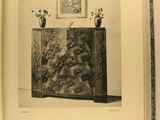 an open book with a picture of a plant in a vase