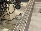 a man that is standing in front of a conveyor belt
