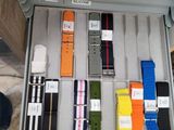 someone is holding a box with a bunch of watches in it