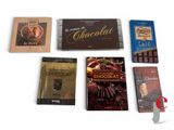 many chocolates that are sitting on a table