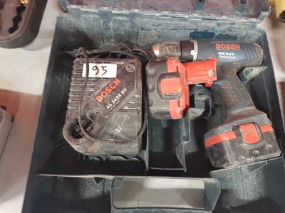 two electric tools in a box on a table
