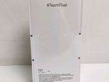 the back of a white box with a picture of a team pixell logo on it