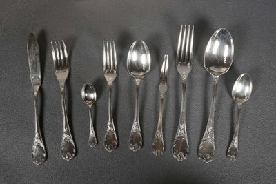 a lot of silver spoons and forks on a table