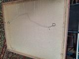 a picture of a piece of cardboard with a pair of scissors in it